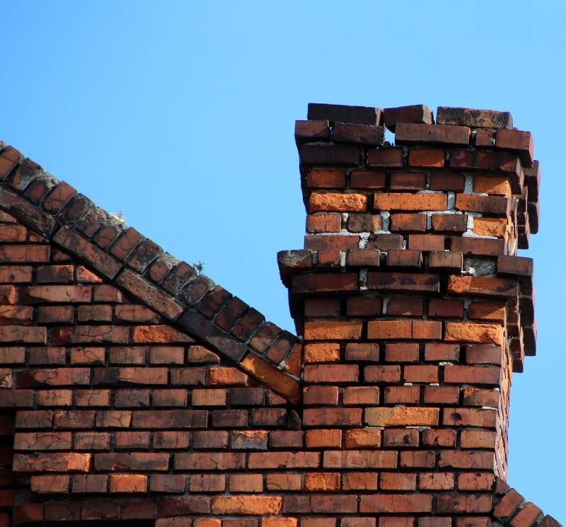 Signs Your Braintree Home Needs a Chimney Inspection Damaged chimney on an Braintree home showing cracks and missing mortar